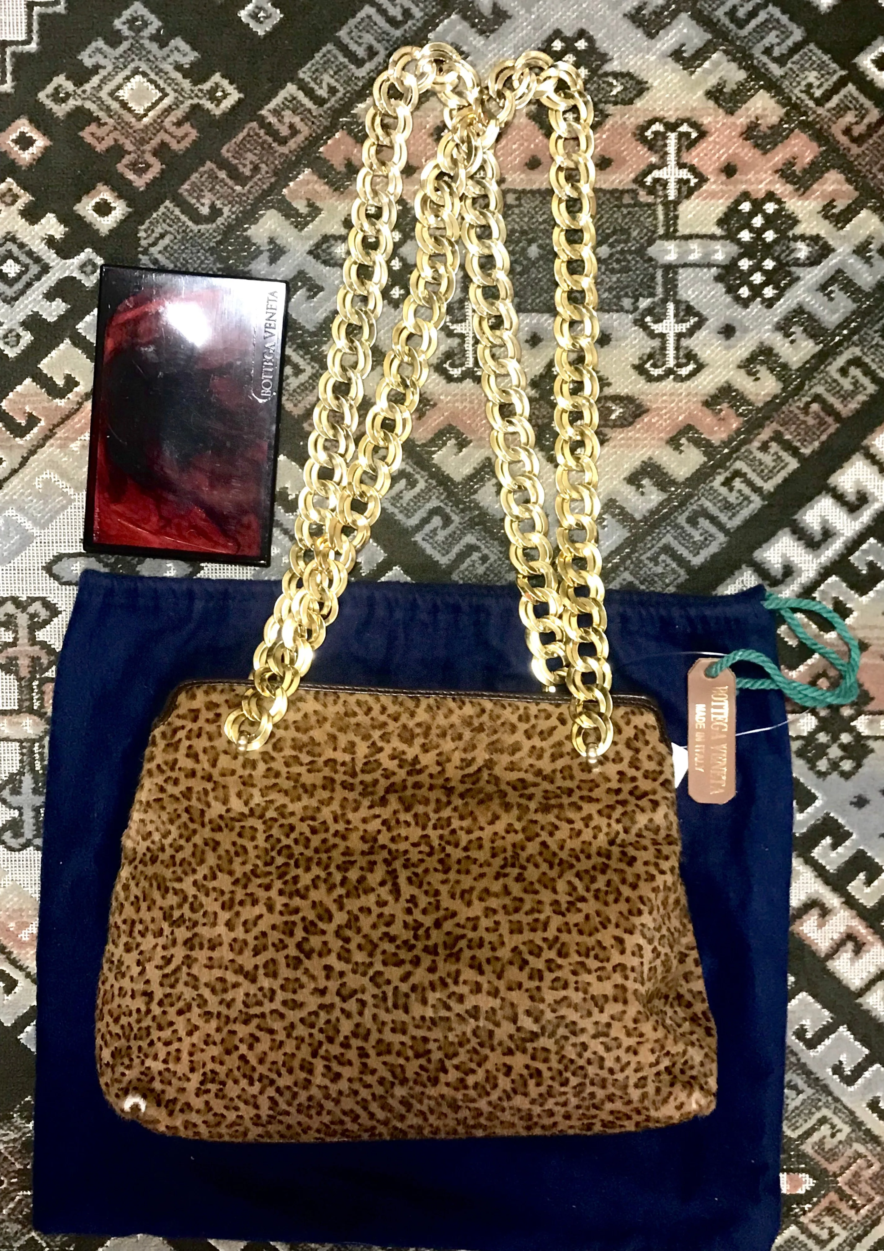 Vintage Bottega Veneta genuine leather shoulder bag with allover faux leopard print and double golden chain straps.