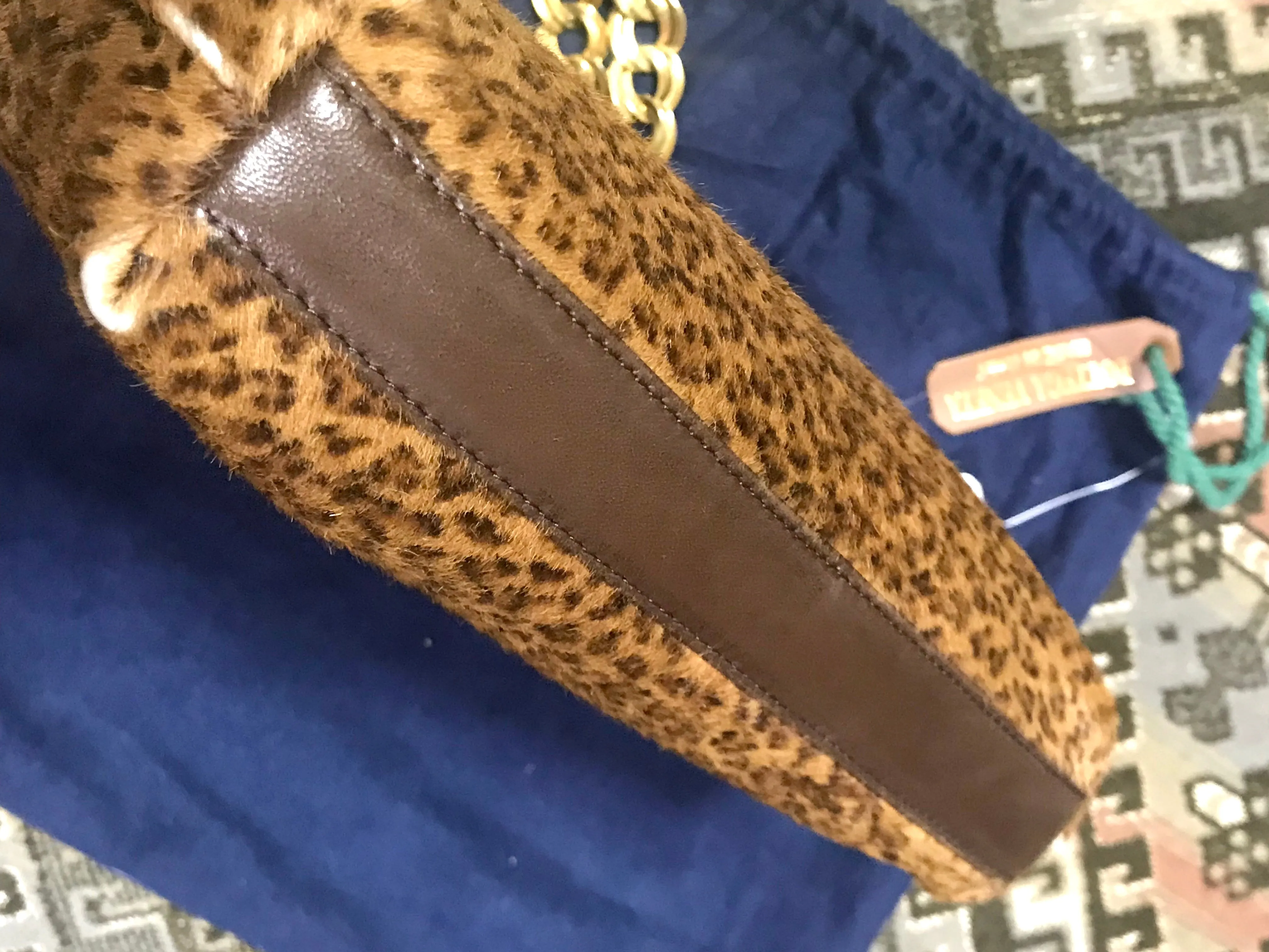 Vintage Bottega Veneta genuine leather shoulder bag with allover faux leopard print and double golden chain straps.