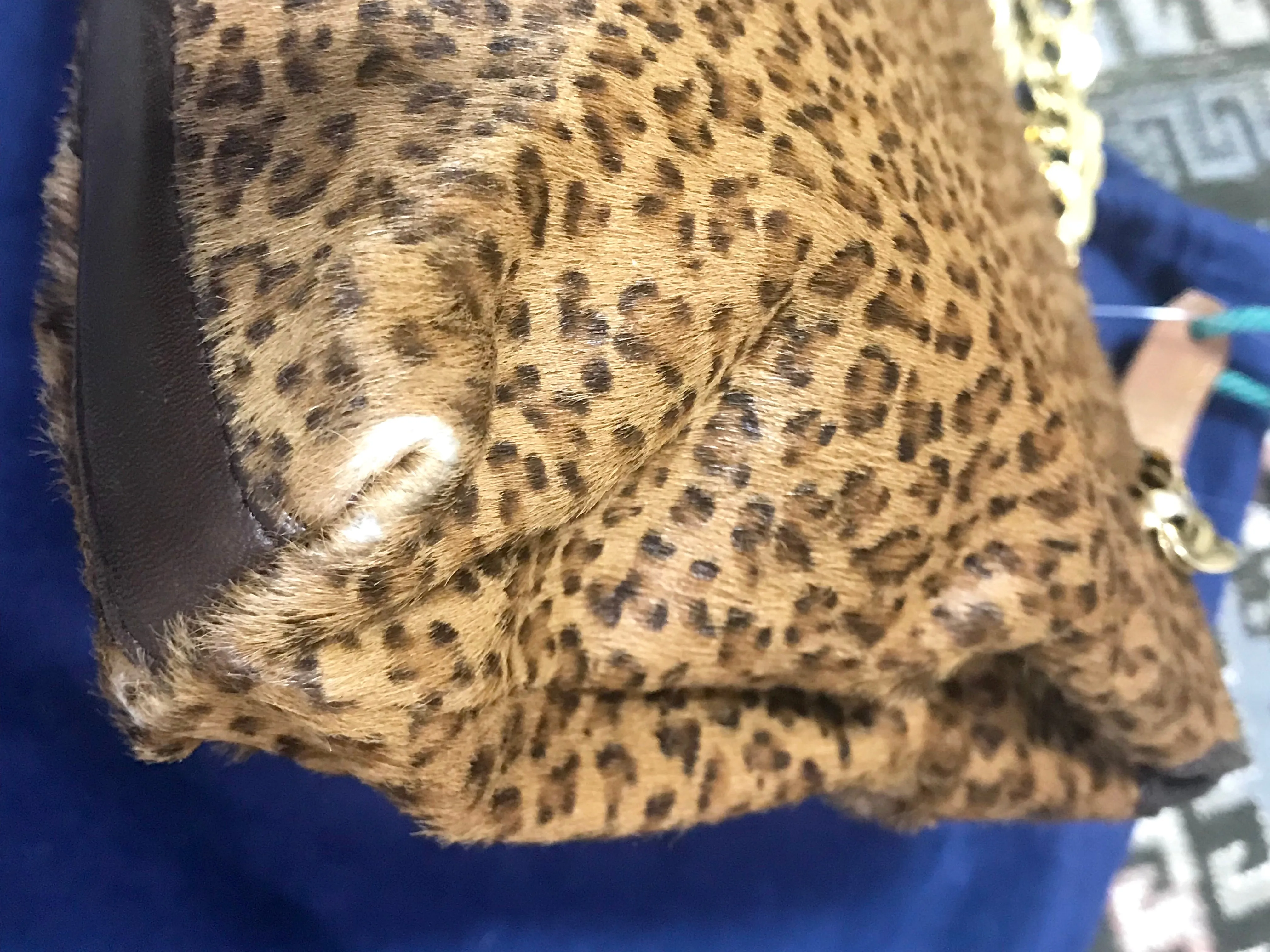 Vintage Bottega Veneta genuine leather shoulder bag with allover faux leopard print and double golden chain straps.