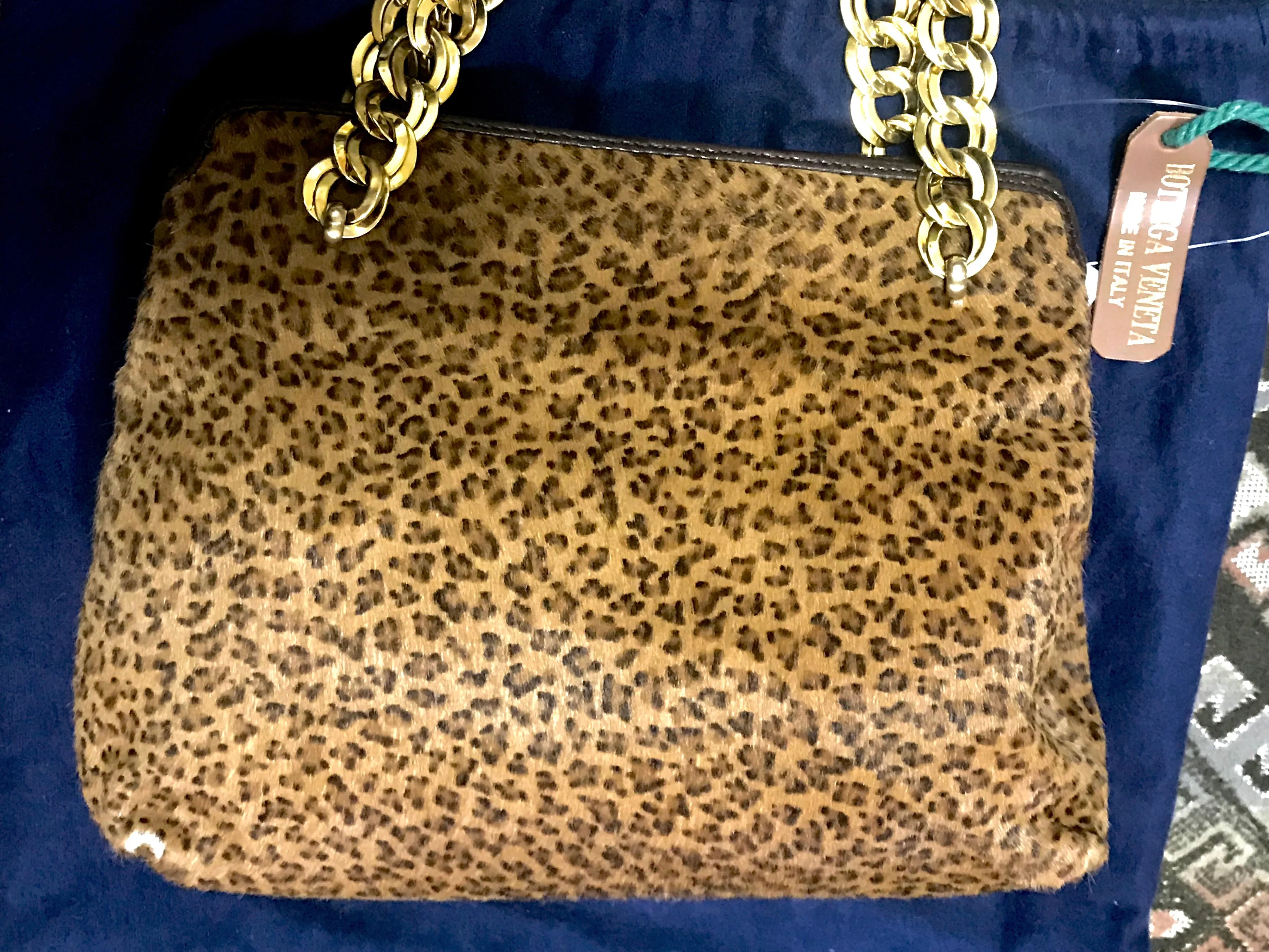 Vintage Bottega Veneta genuine leather shoulder bag with allover faux leopard print and double golden chain straps.